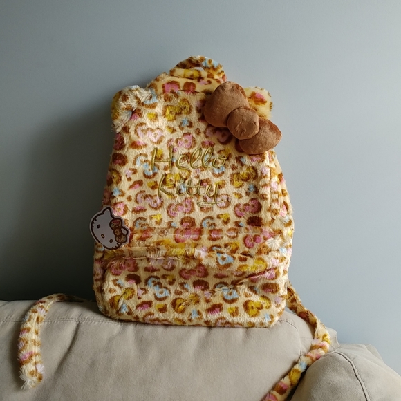 Sanrio Handbags - Hello Kitty rainbow leopard print bow fuzzy plush backpack